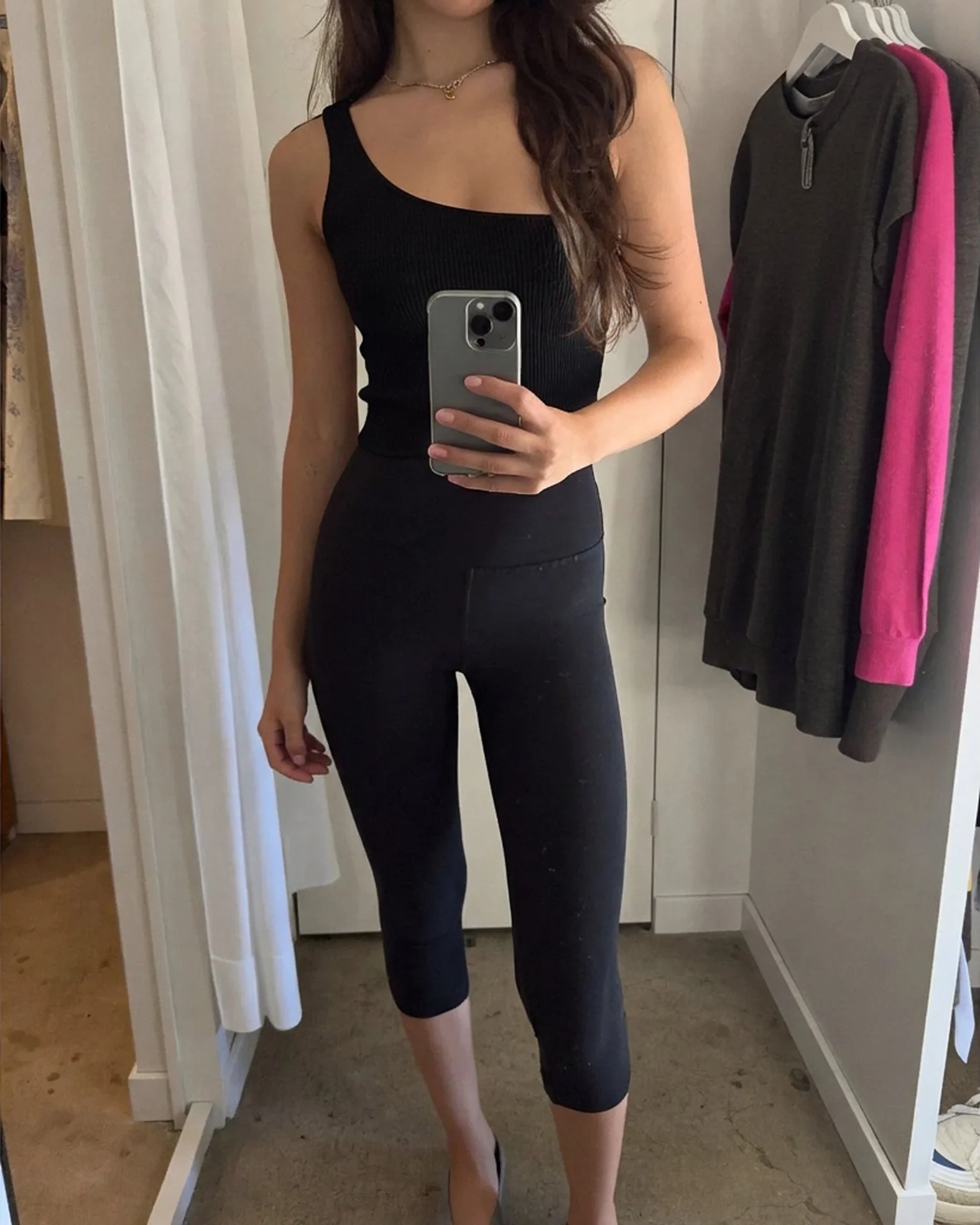 Black knit top with natural fabric drape preserved — after