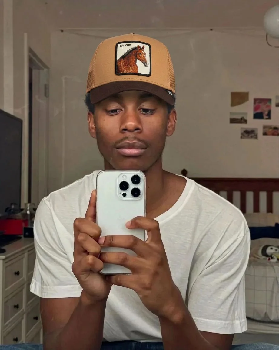 Trucker cap sitting correctly over hair volume — after
