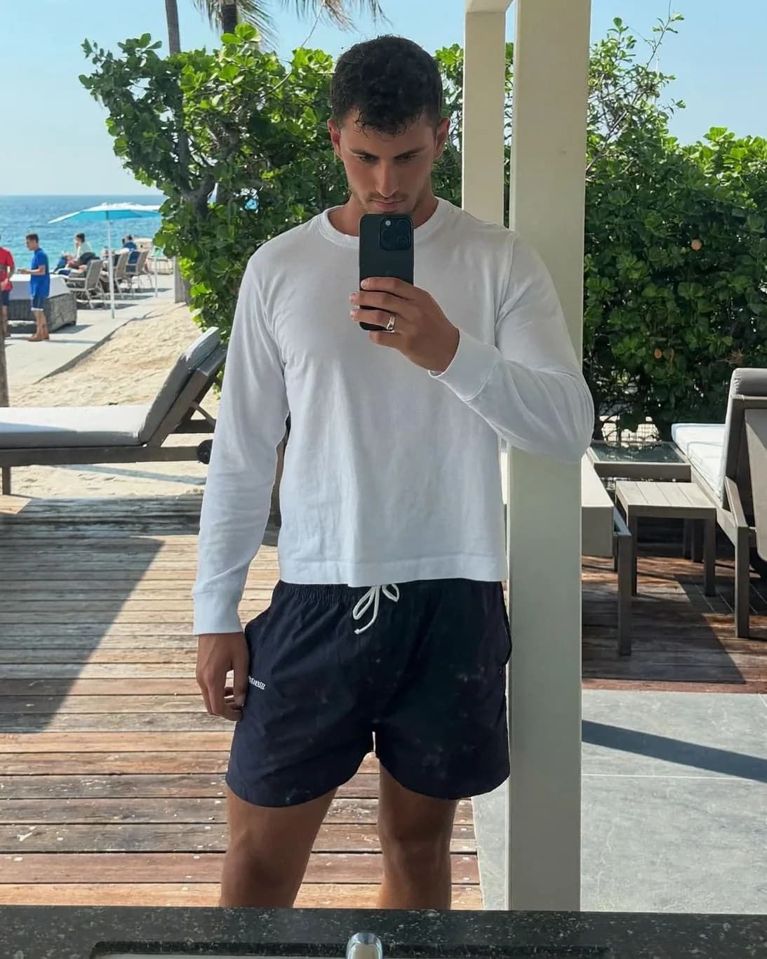 Men's board shorts showing true inseam length — before