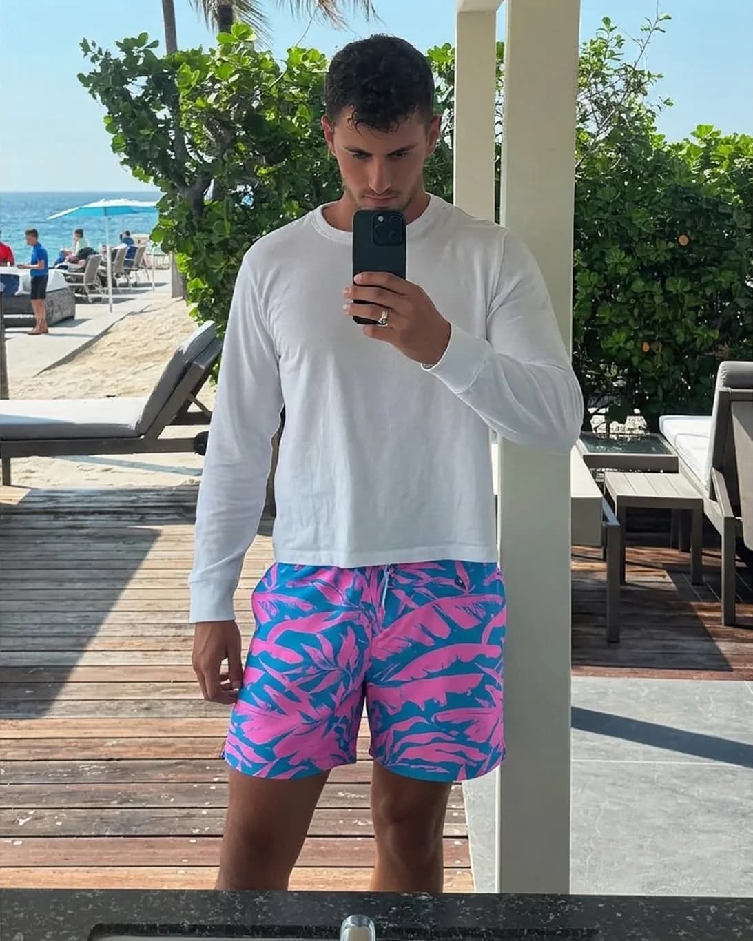 Men's board shorts showing true inseam length — after